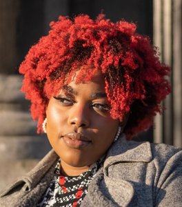Beautiful black woman with coily red hair